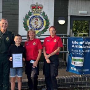 Oscar with ambulance staff and call handlers