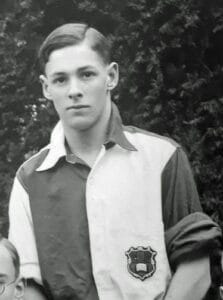 Peter Drew in hockey gear with team mates at Marlborough College