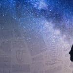 Back of a woman looking at lots of mathematical papers, with milky way stars in the background