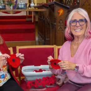 catherine and steph knitting poppies in the church