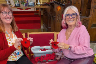 catherine and steph knitting poppies in the church