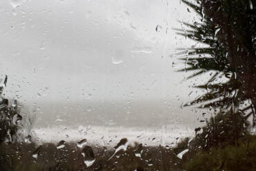Looking at a rainy scene through a house window