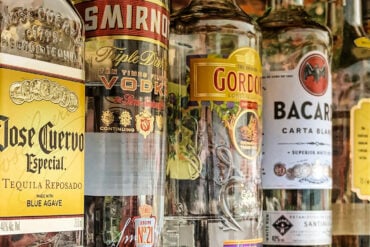 row of alcohol bottles on a shelf