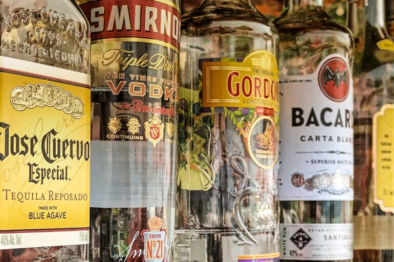 row of alcohol bottles on a shelf